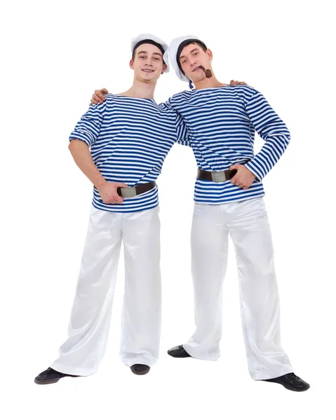 Twee mannelijke dansers gekleed als een zeeman poseren tegen geïsoleerde wit in volle lengte. — Stockfoto