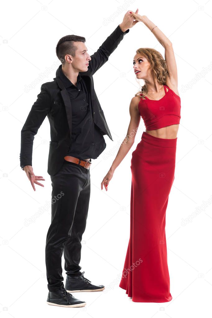 Young elegant couple dancing, isolated on white