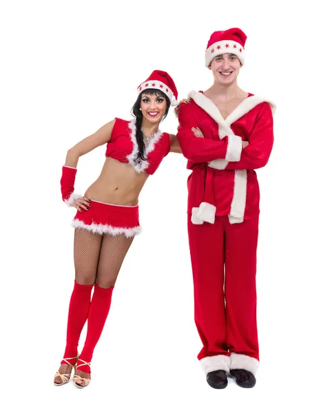 Happy young couple wearing santa claus clothes — Stock Photo, Image