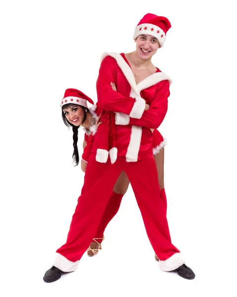 Happy young couple wearing santa claus clothes — Stock Photo, Image