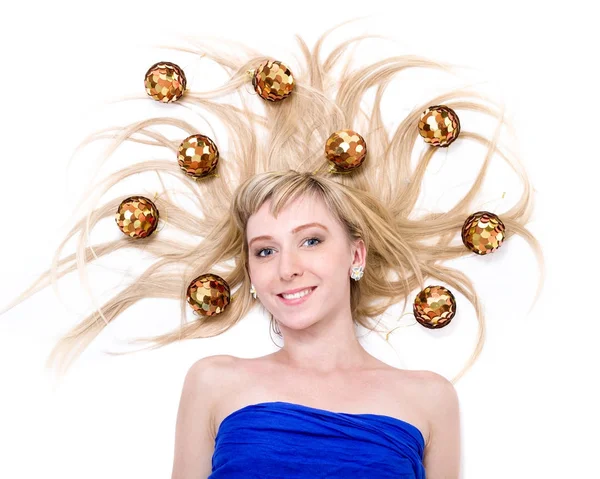 Beautiful young smiling woman with Christmas decorations against isolated white — Stock Photo, Image