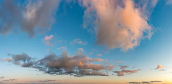 Fantastic clouds against blue sky, panorama — Stock Photo, Image