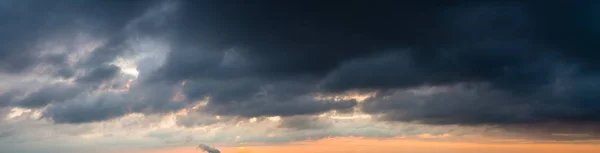 Fantastic dark thunderclouds at sunrise — Stock Photo, Image