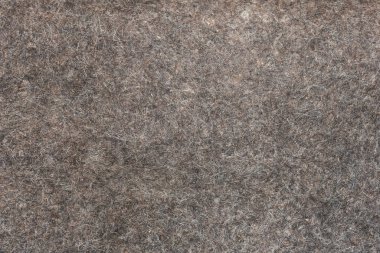 Doğal gri keçenin yüzey dokusu, arka plan.