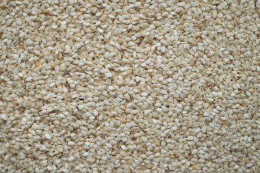 Beyaz susam tohumları, organik arka plan, kapat.