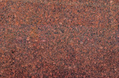 Doğal kahverengi granitin cilalı yüzeyinin dokusu..