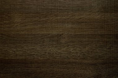 Koyu ahşap desenli kaplama bir panel..