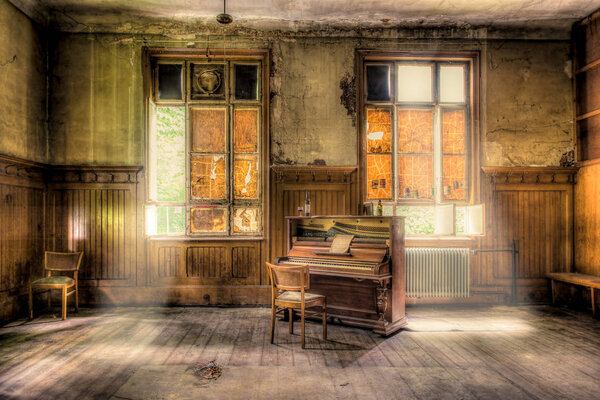 old piano in abandoned room