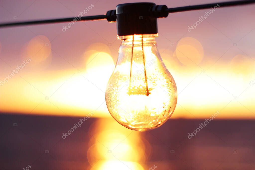 String Light during sunset. Sea background. Abstract.