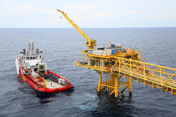 Offshore construction platform for production oil and gas. Oil and gas industry and hard work. Production platform and operation process by manual and auto function from control room.