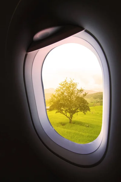 Plane window and view from plane to someplace, plane window with view of people in journey to someplace, plane view and plane window background from the sky, travel business with plane of travel trip.