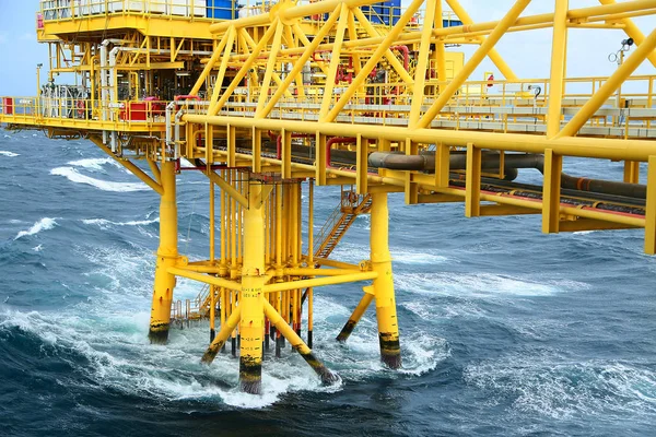 Well head slot from ground to main production floor and controlled by automation logic for production oil and gas industry. Offshore construction platform for production oil and gas in the gulf.