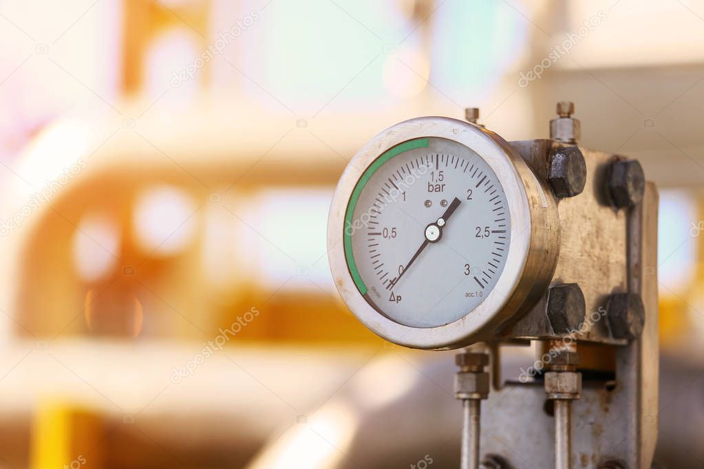 Pressure gauge in oil and gas production process for monitor condition, The gauge for measure in industry job, Industry background and close up gauge , gauge for measure pressure in the process.