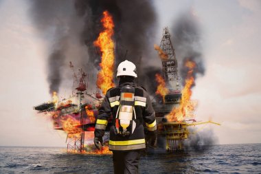 İtfaiyeci misyonu için başarılı olan petrol ve gaz sektöründe korumak ile acil durum ya da en kötü ihtimalle, itfaiye ekibi ve ekip çalışması için tehlike misyonu kişisel koruyucu ekipman.