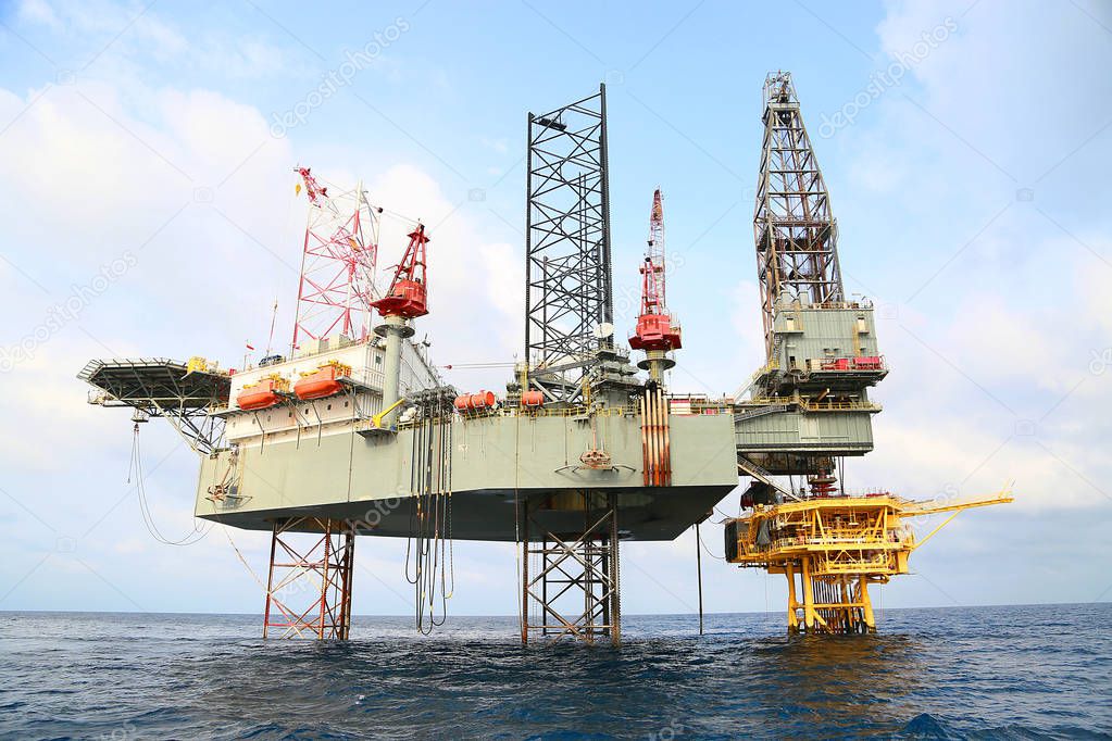 Offshore construction platform for production oil and gas. Oil and gas industry and hard work industry. Production platform and operation process by manual and auto function from control room.