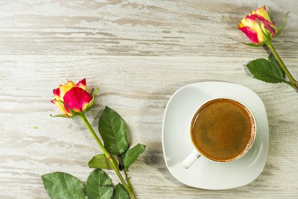 Cup of the coffee with roses