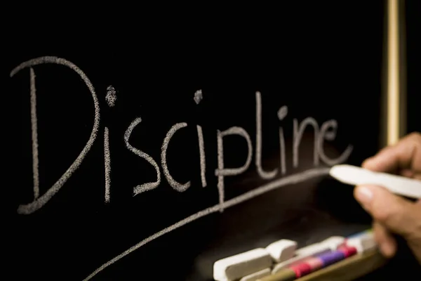 Het concept van discipline, de inscriptie op de achtergrond van — Stockfoto