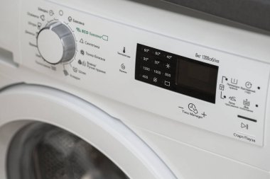 Display washing machine. Macro photo part of modern home washing machine clipart