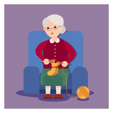 Büyükanne bir koltukta oturur ve dokuma kumaşlar