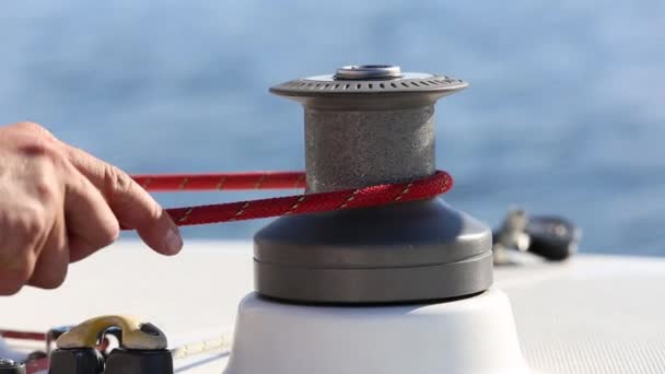 Sailor and winch on yacht — Stock Video