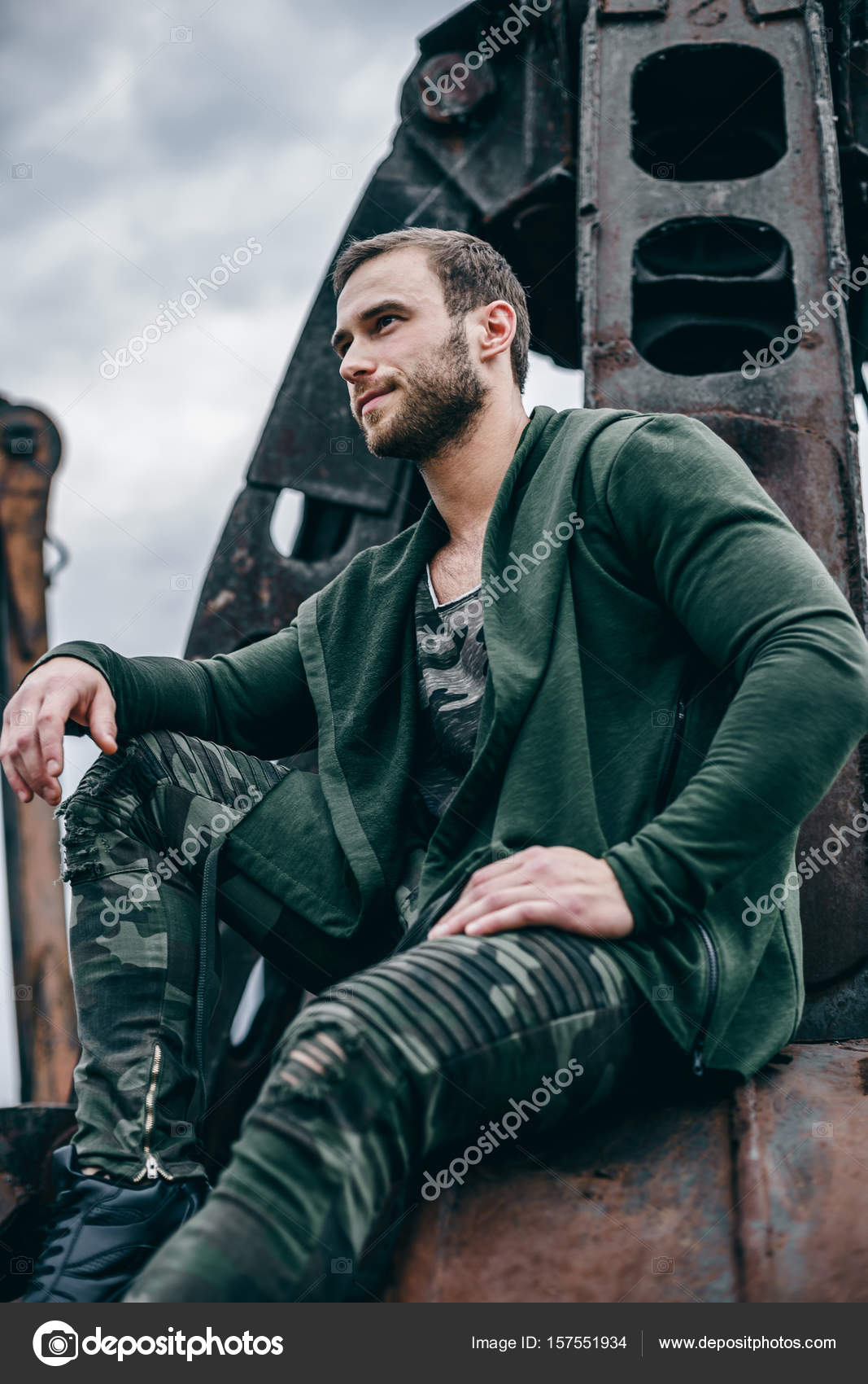 Portrait fashion man wearing clothes khaki colors in urban