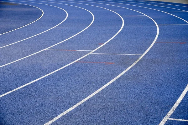 Blue racetracks with white markings. — Stock Photo, Image