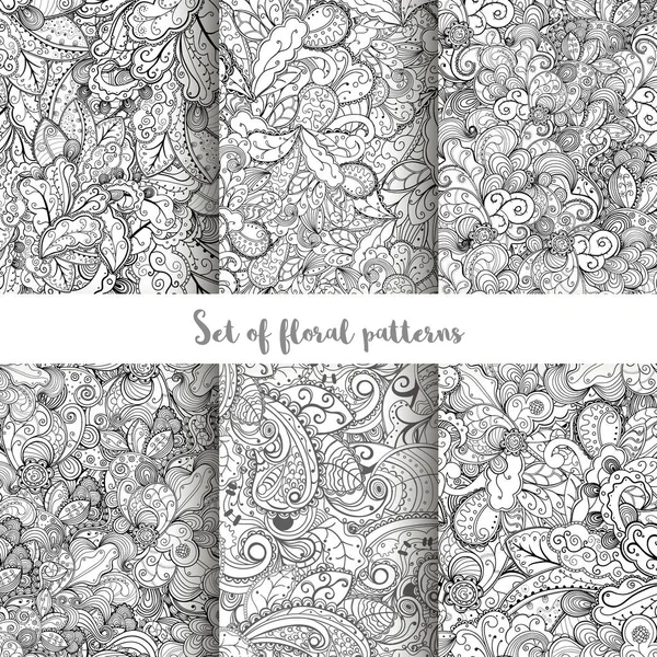 Set van vector hand getrokken swirl bloemmotieven. — Stockvector