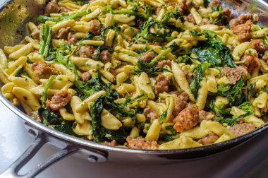 Cooking Sausage Cavatelli Broccolini clipart