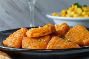 Battered and deep-fried macaroni and cheese wedges appetizer clipart