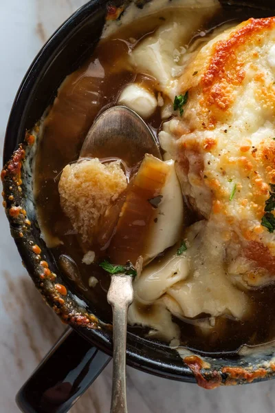 French onion soup with crispy gruyere cheese over toast