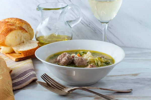 Italian wedding soup with sausage meatballs and orzo pasta