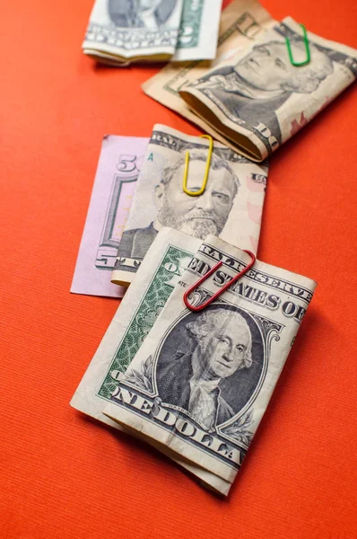 Founding fathers folded with paper clips in pictures on American money