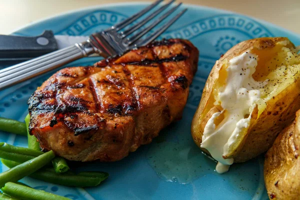 Grilled Porkchops Marinated Honey Glaze Baked Potatoes Broccoli Green Beans — Stock Photo, Image