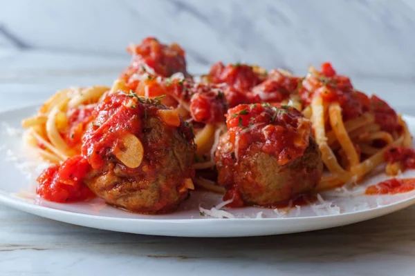 Italian linguine spaghetti and meatballs with red tomato sauce