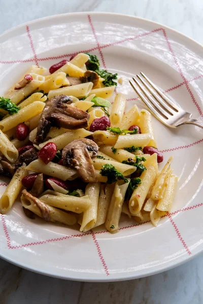 Kidney bean mushroom kale penne pasta with white wine butter sauce