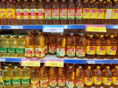 Saigon/Vietnam: 1May19: Simply Cooking oil Vegetable sunflower peanut olive oil in big can in supermarket shelf healthy choice for heart original soy oil for baking cooking.