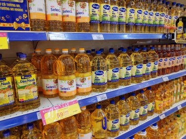Saigon/Vietnam: 1May19: Simply Cooking oil Vegetable sunflower peanut olive oil in big can in supermarket shelf healthy choice for heart original soy oil for baking cooking.