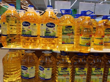 Saigon/Vietnam: 1May19: Simply Cooking oil Vegetable sunflower peanut olive oil in big can in supermarket shelf healthy choice for heart original soy oil for baking cooking.