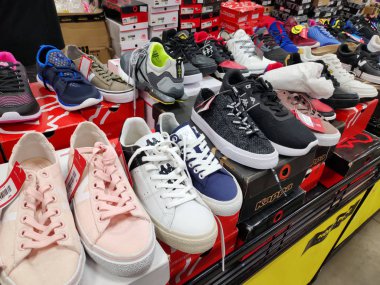 Saigon/Vietnam: 1May 19: Beautiful fashionable shoes for male and female sneakers sport shoes in supermarket