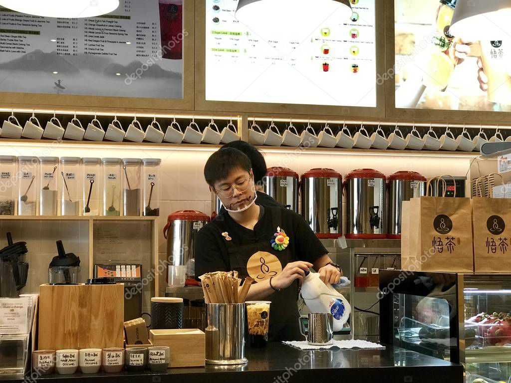 Queenstown/New Zealand:1May 19: WuCha bubble tea famous Taiwanese milk tea with tapioca pearl caramelize sugar milk tea sweet beverage Gongcha dessert delicious treat with cute stuffed animal