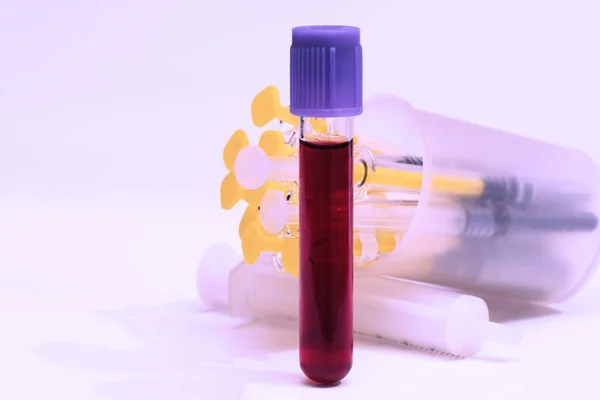 Test tube and syringes — Stock Photo, Image