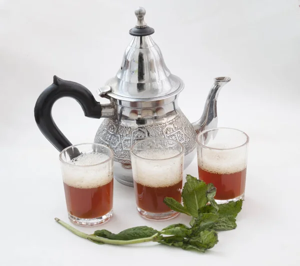 Traditional Moroccan tea on white