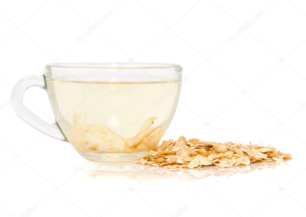 Cap of ginseng tea with sliced ginseng