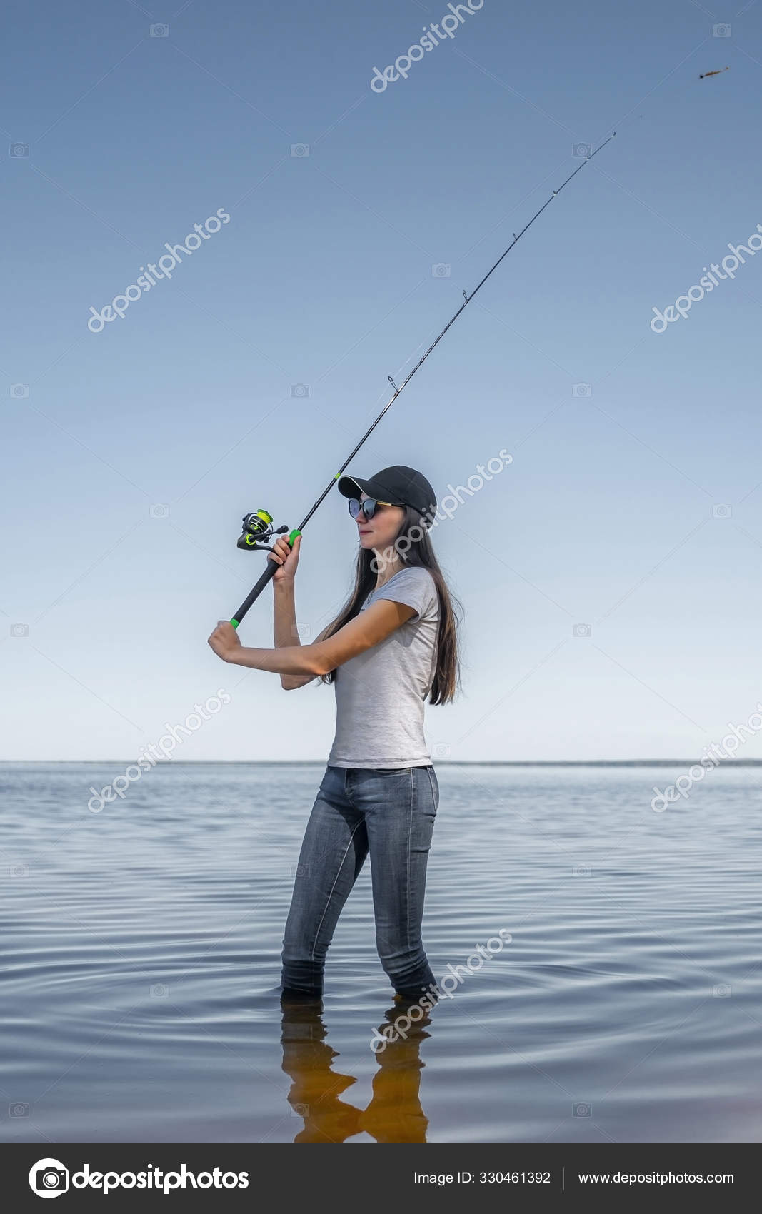 https://st3.depositphotos.com/17928540/33046/i/1600/depositphotos_330461392-stock-photo-fishing-concept-young-fisherwoman-with.jpg