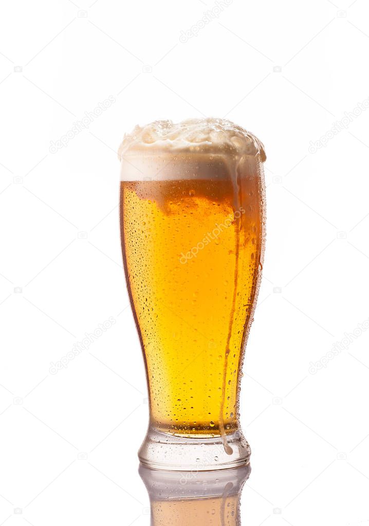 light cold beer in frosty glass isolated on white