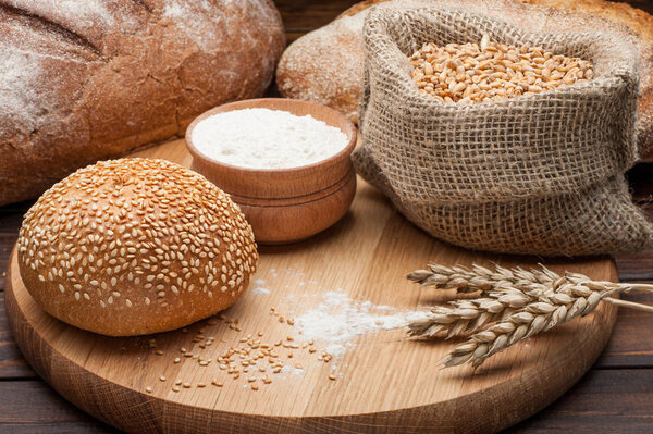 bun wheat flour on wooden background