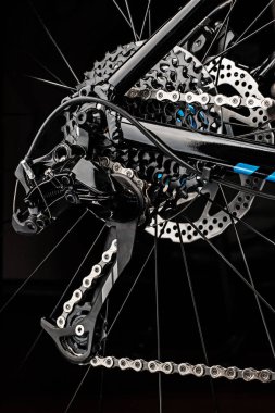 mountain bicycle gears system on dark background clipart