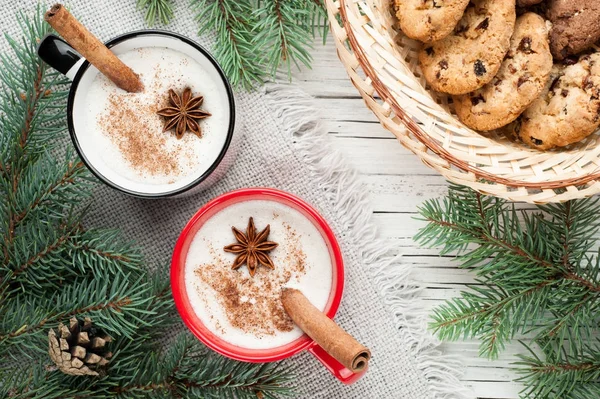 Eggnog cocktail in mug arranged with christmas decoration and co — Stock Photo, Image