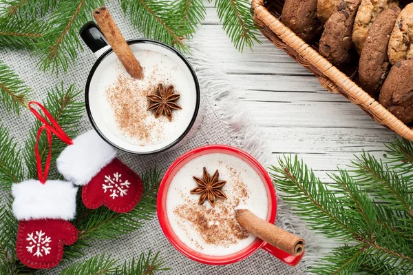 Eggnog cocktail in mug arranged with christmas decoration and co — Stock Photo, Image