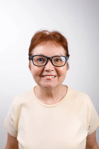 Happy Senior Woman Glasses White Background Light Shirt Place Text — Stock Photo, Image
